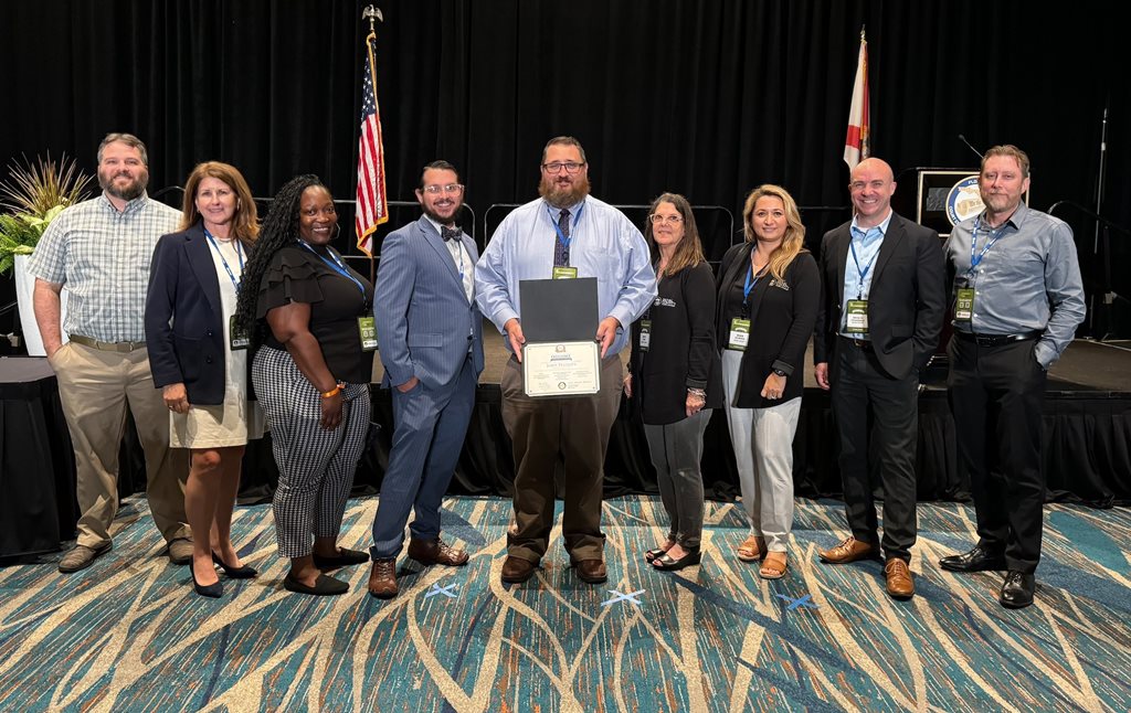 Clerk employees accepting award