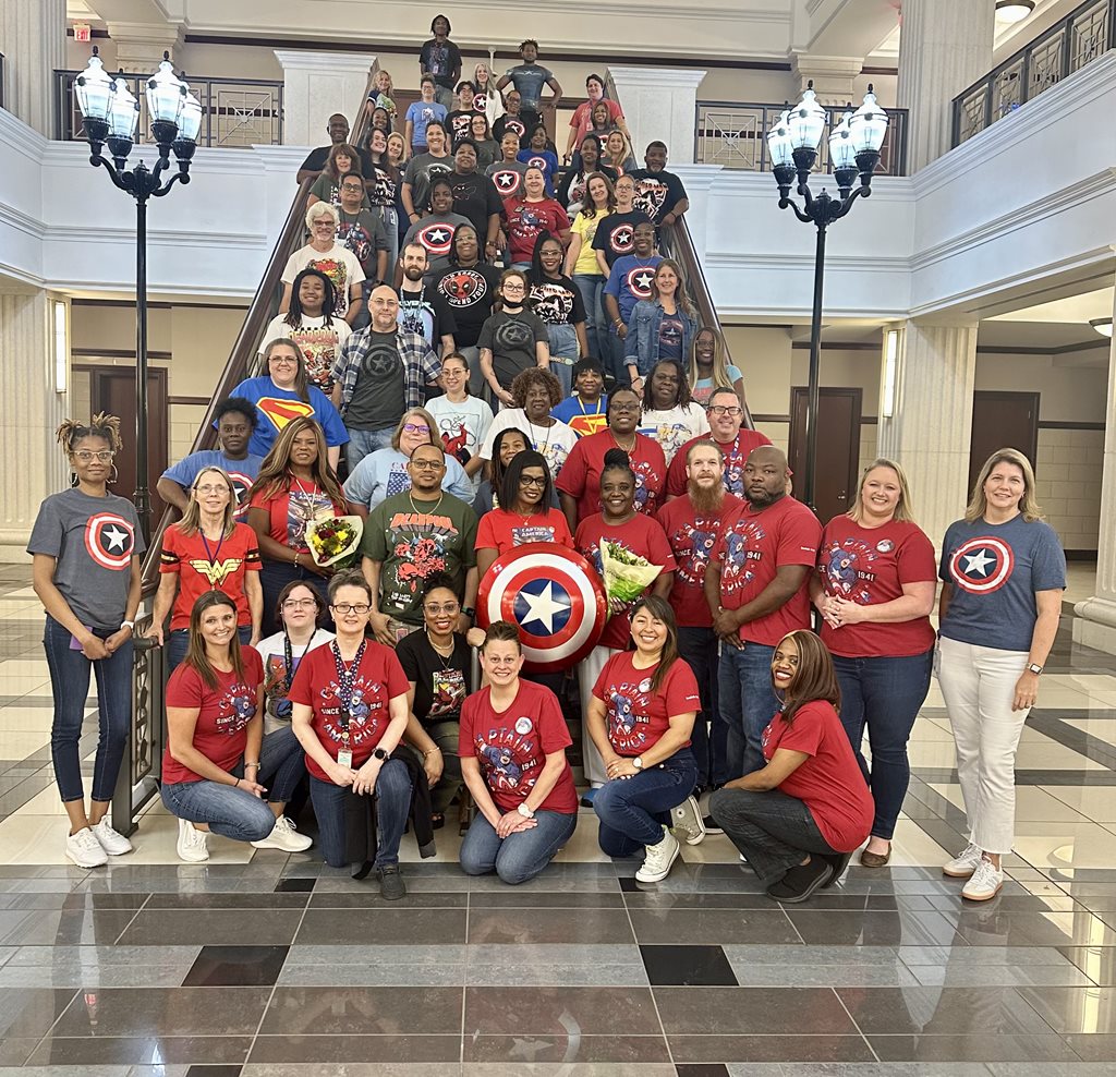clerk employees wearing superhero shirts