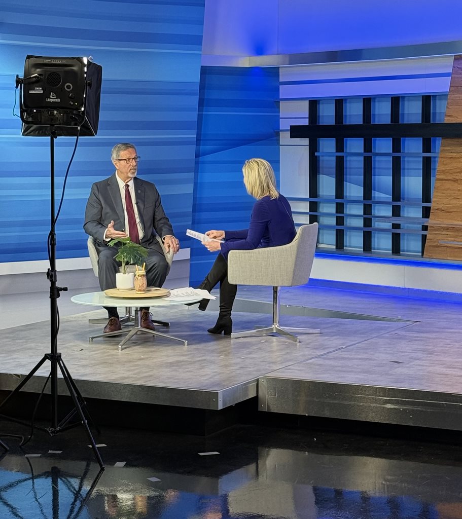 Clerk Phillips seated in chairs conducting an interview on the set of News4Jax with Jennifer Waugh