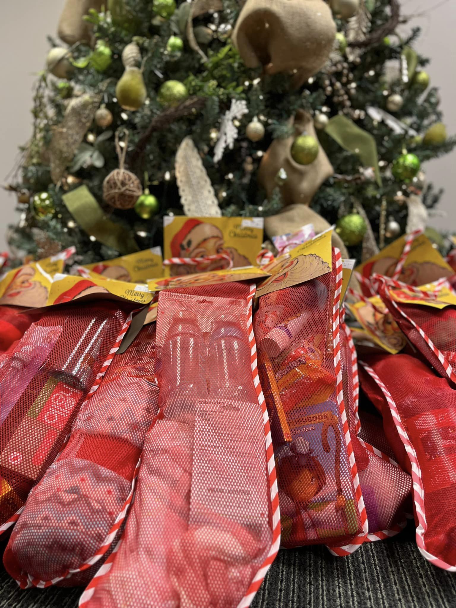 Stockings collected arranged under a Christmas tree